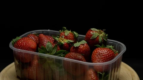 Strawberries in a plastic container Stock Footage 106754586