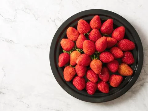 Strawberries on a plate Stock Photos