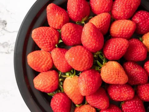 Strawberries on a plate Stock Photos