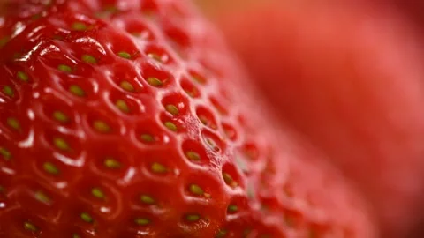 Strawberries on a red background. Two Fresh ripe strawberries on red Stock Footage 233578874