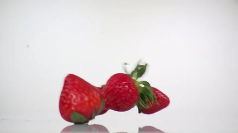Strawberries Rolling left to right, in slow motion. Stock Footage 61643264