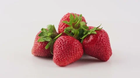 Strawberries rotate on a white background Stock Footage 133267237