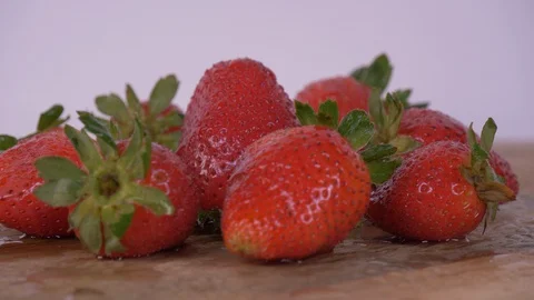 Strawberries Rotating over white Background, Strawberries Video stock 127996935