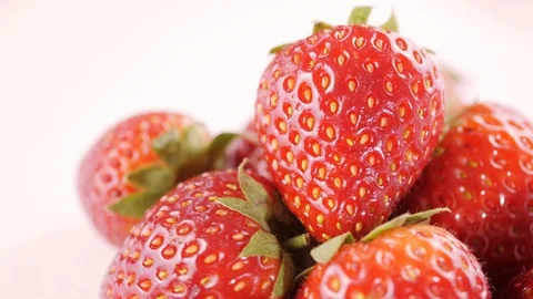 Strawberries rotating on white background Stock Footage 104709412