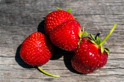 Strawberries  on a rustic background Stock Photos