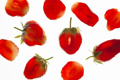 Strawberries in a section on a white background Stock Photos