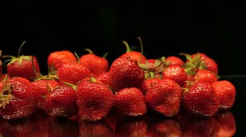 Strawberries Slide on Black Stock Footage 11863335