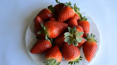 Strawberries Spin on a Plate Stock Footage 47360289