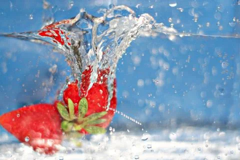 Strawberries Splash Stock Photos