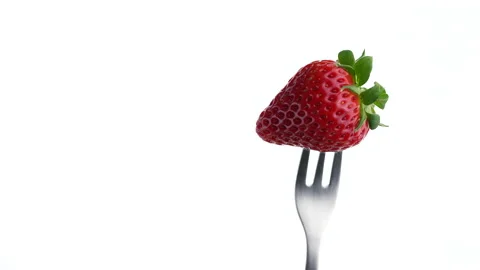 Strawberries stuck on a fork. Stock Footage 153004256