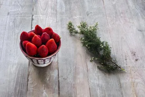 Strawberries with thyme Stock Photos