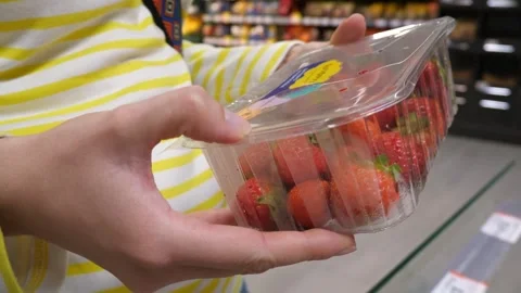 Strawberries in a tray in hands. Stock Footage 283929810