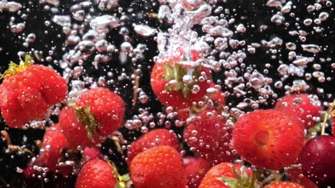 Strawberries in water slow mo Stock Footage 201339052