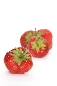 Strawberries on white Stock Photos