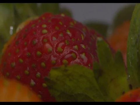 Strawberries on a white plate being sprayed with water Stock Footage 74197098