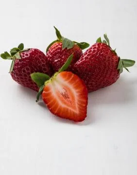 Strawberries on white table Stock Photos