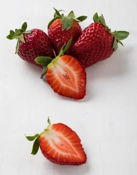 Strawberries on white table Stock Photos