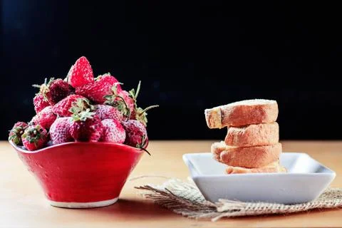 Strawberry and cake on table. Stock Photos