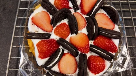 Strawberry and Cookie Dessert Waffle with Whipped Cream at Street Food Market Stock Footage 335998737