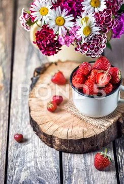 Strawberry and flowers Stock Photos