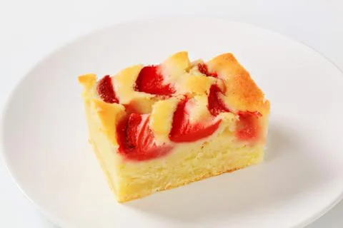 Strawberry and pineapple cake slice on plate Stock Photos
