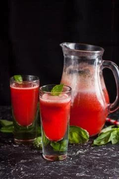 Strawberry basil lemonade on dark table Stock Photos