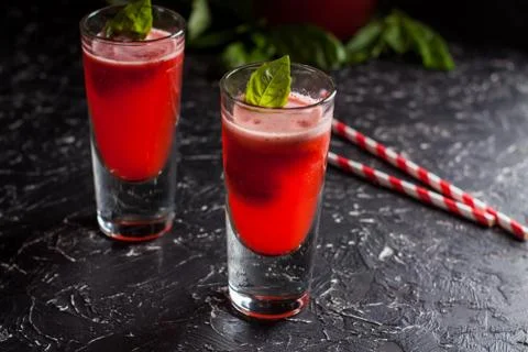 Strawberry basil lemonade on dark table Stock Photos