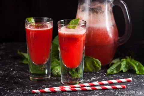 Strawberry basil lemonade on dark table Stock Photos