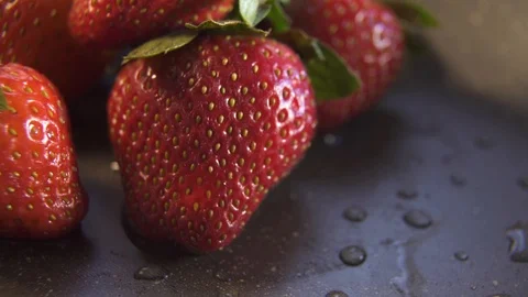 Strawberry berries close up on a dark background Stock Footage 124482378