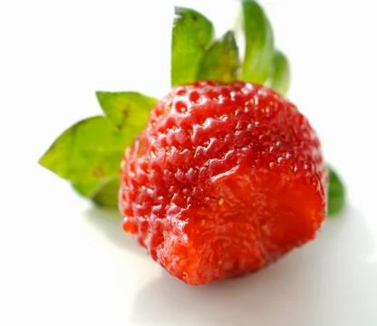 A strawberry with a bite taken Foto stock