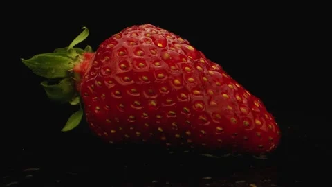Strawberry On Black Background Camera Rolling Back  Stock Footage 131800522