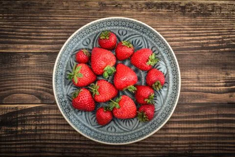 Strawberry in bowls Stock Photos