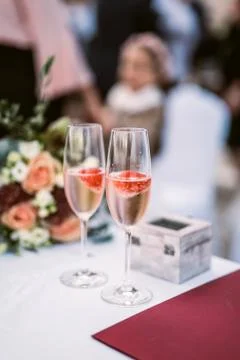 Strawberry in champagne in glasses Stock Photos