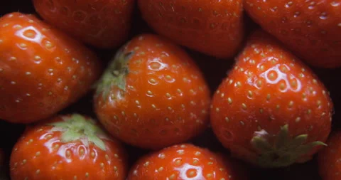Strawberry close up studio shot over rotating Stock Footage 324845812