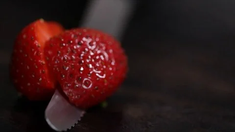 Strawberry is Cut into Halves Closeup Stock Footage 99162748
