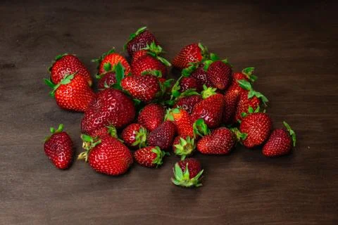 Strawberry on a dark wood background. Creative pattern concept. - Image 스톡 사진