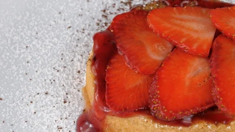 Strawberry dessert, close-up view, with sliced strawberries on top and jam, loop Stock Footage 95344591