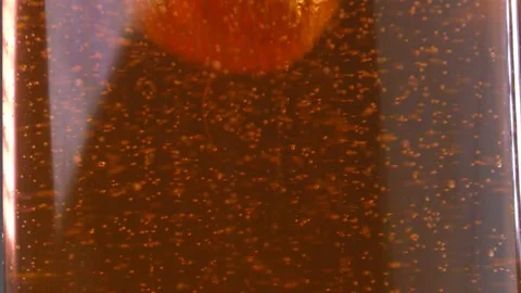 A strawberry is dropping in lemonade Stock Footage 138368125