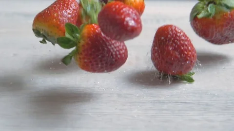 Strawberry dropping on the white table, fresh fruits, sweet for children, party Video stock 96995251