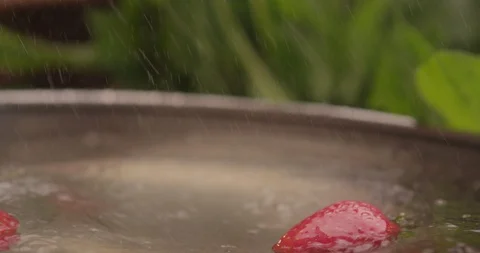Strawberry drops into water with splash 4 Stock Footage 123848141