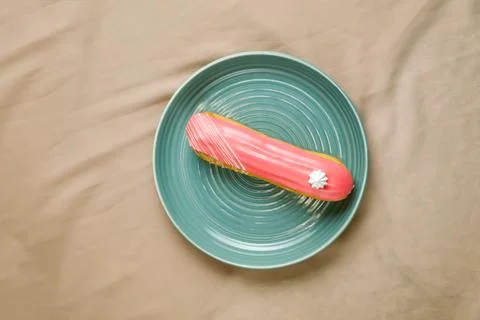 Strawberry Eclair served in plate isolated on napkin top view of cafe baked.. Stock Photos