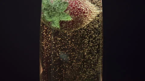 Strawberry Falling In a glass of Champagne Stock Footage 243653643