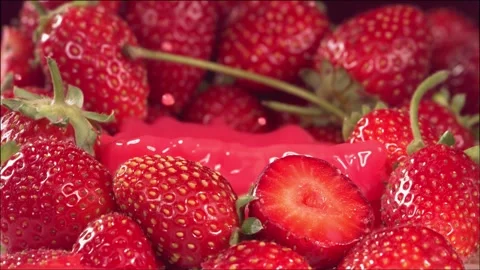 Strawberry falling in juice between strawberries. Slow motion 1000 fps Stock Footage 161304560