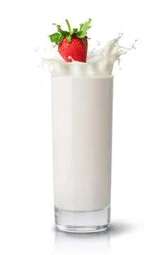 Strawberry falling into milk Stock Photos