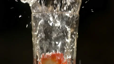 Strawberry falling into sparkling wine (Close up) Stock Footage 162690866