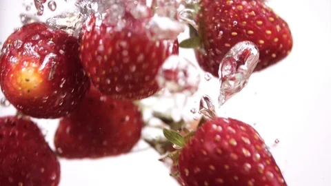 Strawberry falling in water Stock Footage 103982740