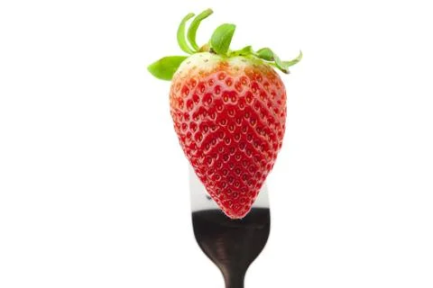Strawberry on fork isolated on white Stock-Fotos
