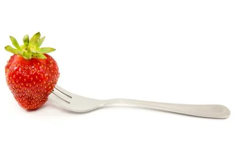 Strawberry on a fork Stock Photos