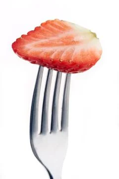 Strawberry on fork Stock Photos