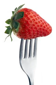 Strawberry on fork Stock Photos